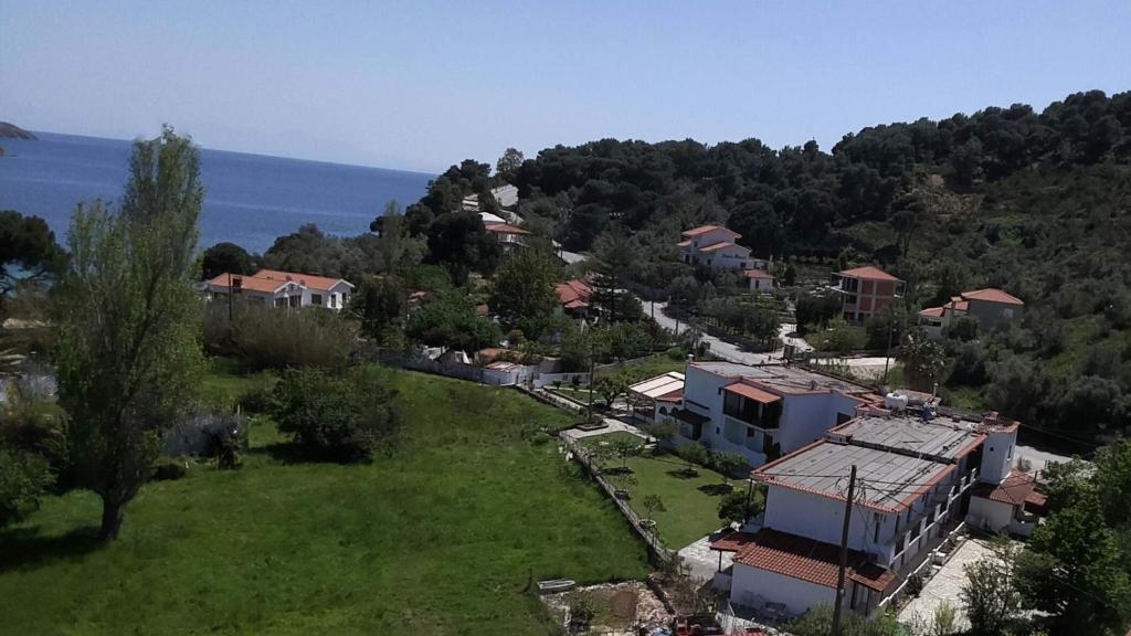 an aerial view of a small village with a house at Vontzos Hotel in Achladies