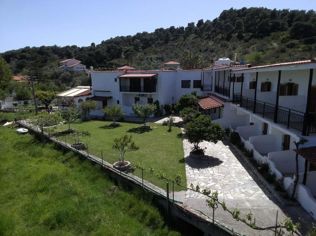 an aerial view of a house with a yard at Vontzos Hotel in Achladies
