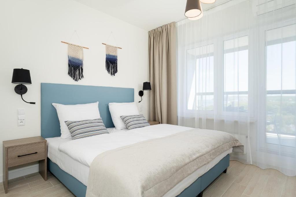 Ein Bett oder Betten in einem Zimmer der Unterkunft Aquamarina Onyx Marina Invest