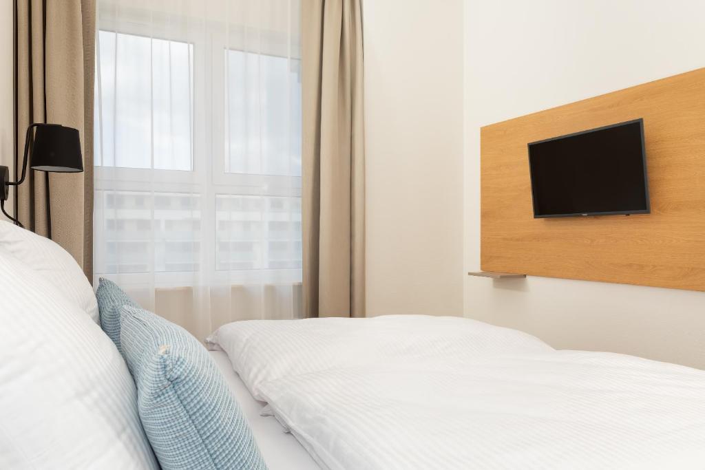 Ein Bett oder Betten in einem Zimmer der Unterkunft Aquamarina Onyx Marina Invest