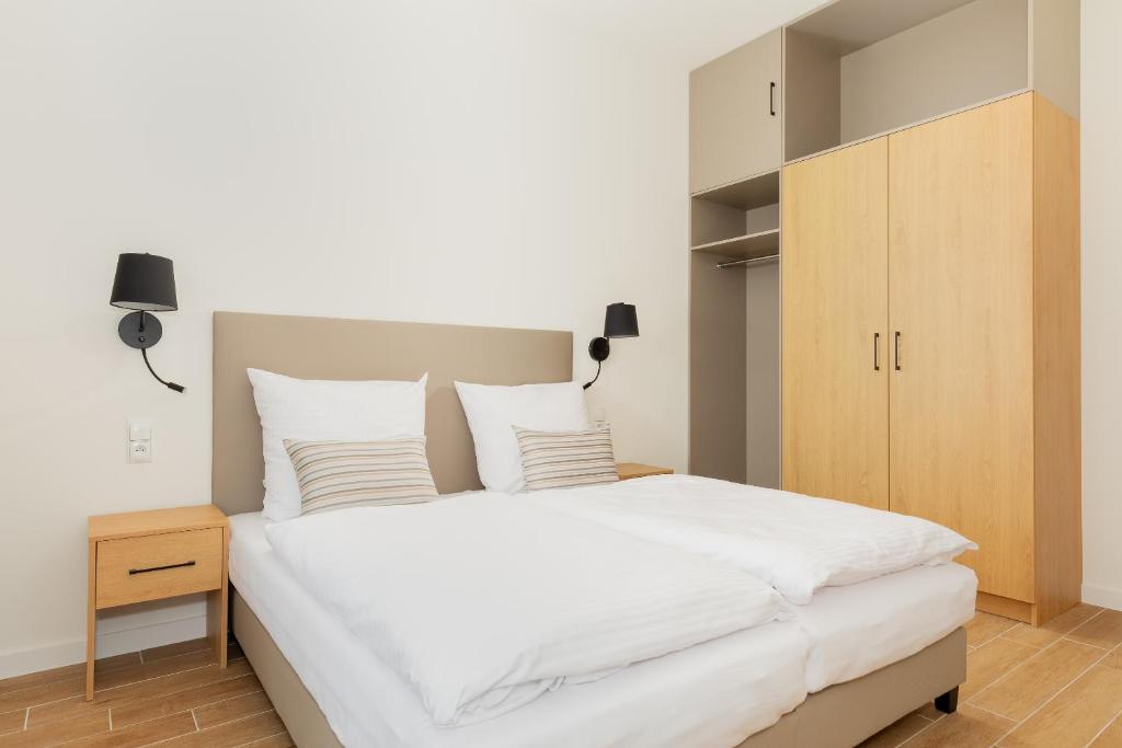 Postel nebo postele na pokoji v ubytování Aquamarina Onyx Marina Invest