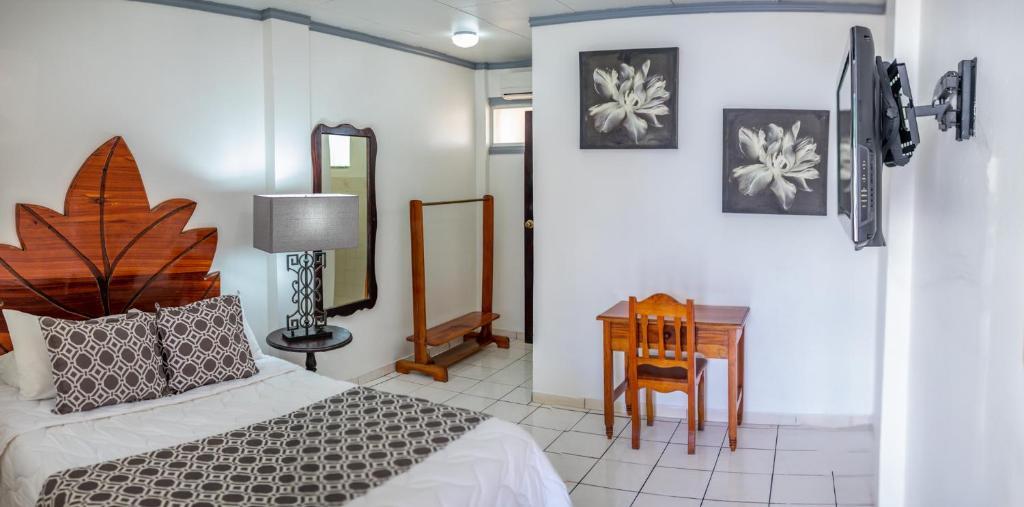 Postel nebo postele na pokoji v ubytování Hotel Andrea