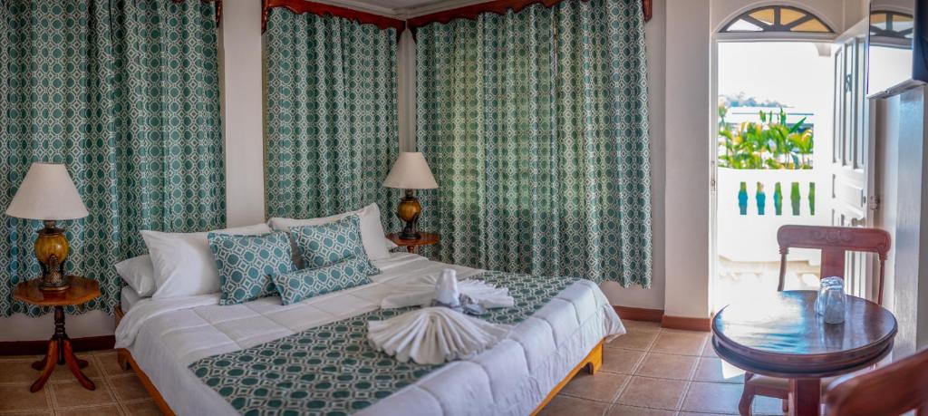 Postel nebo postele na pokoji v ubytování Hotel Andrea