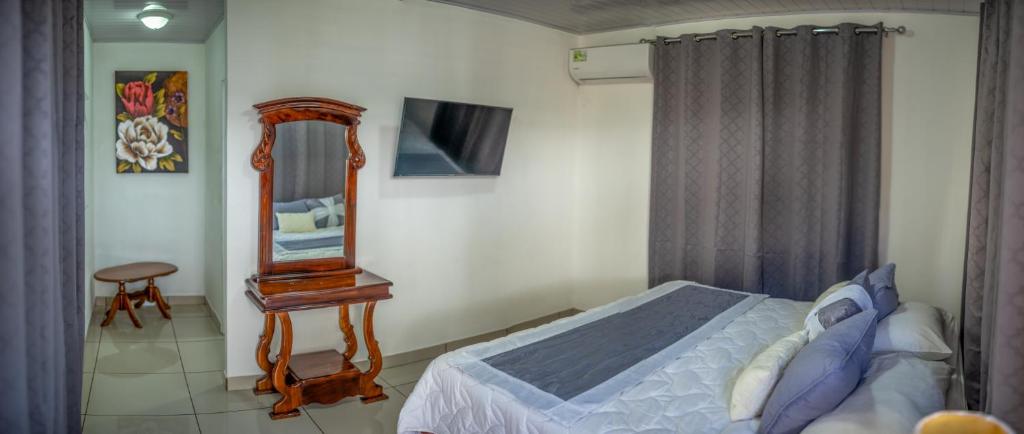 Postel nebo postele na pokoji v ubytování Hotel Andrea