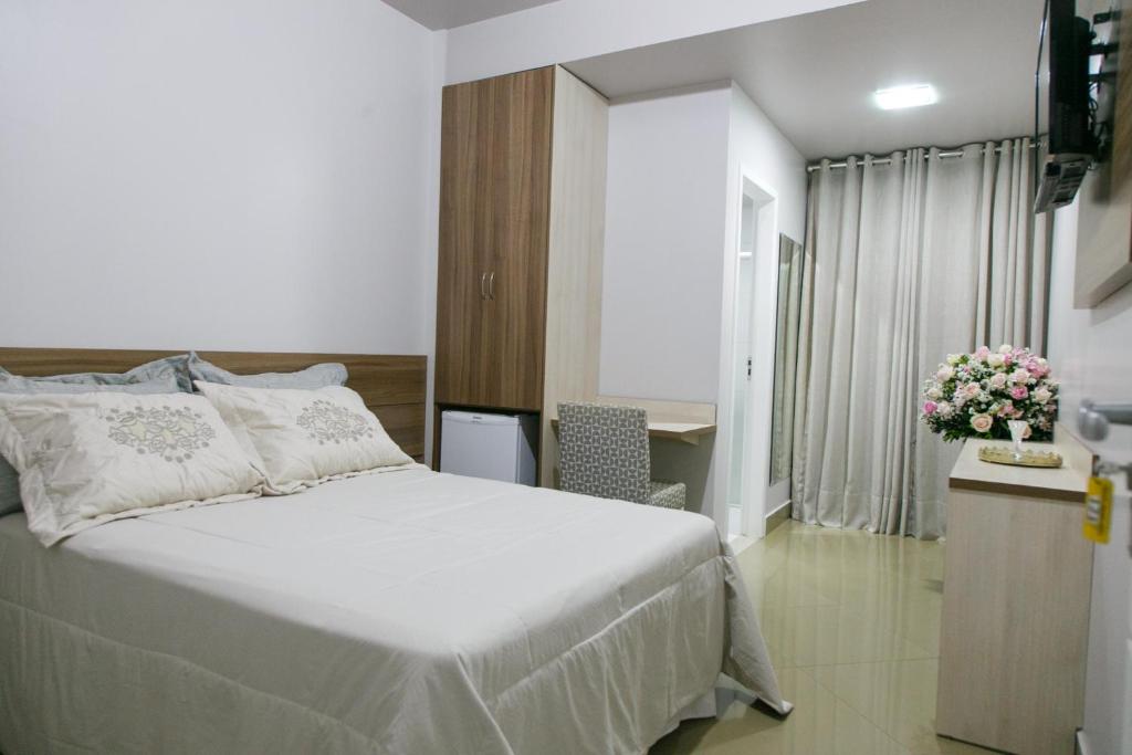 Postel nebo postele na pokoji v ubytování Caetité Palace Hotel