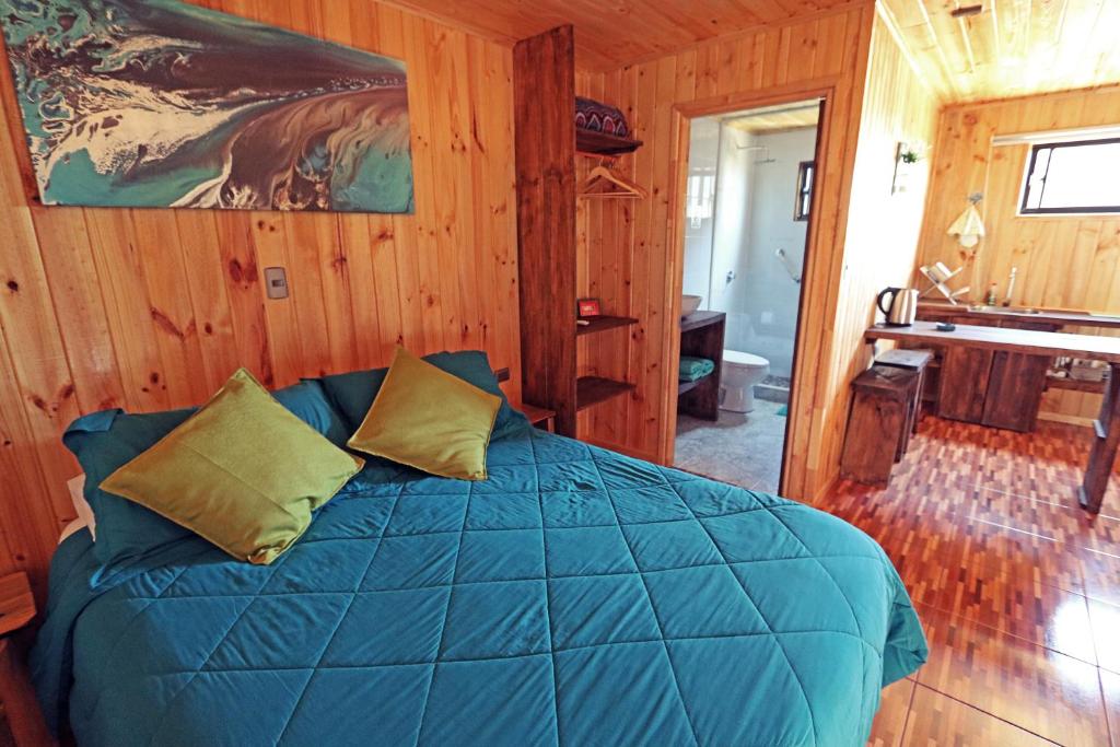 Uma cama ou camas num quarto em ELUNEY Pichilemu