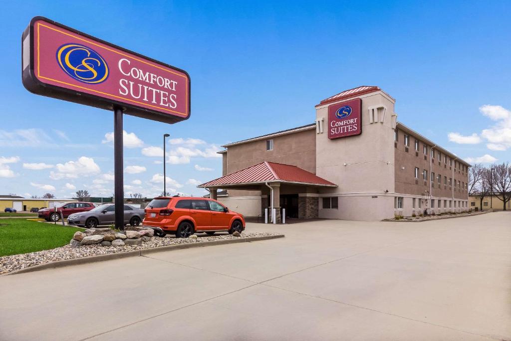 a car dealership with a sign in front of it at Comfort Suites - Sioux Falls in Sioux Falls