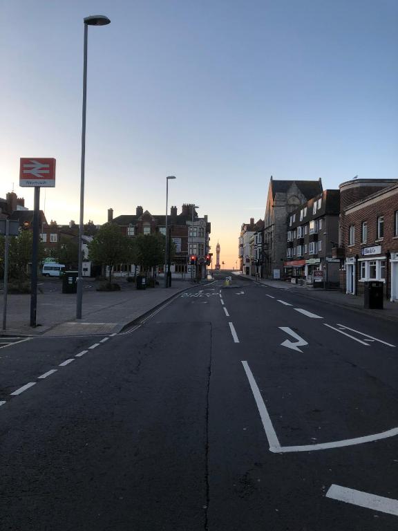 an empty street in a city with buildings at A Stones Throw to the Beach :-) in Weymouth