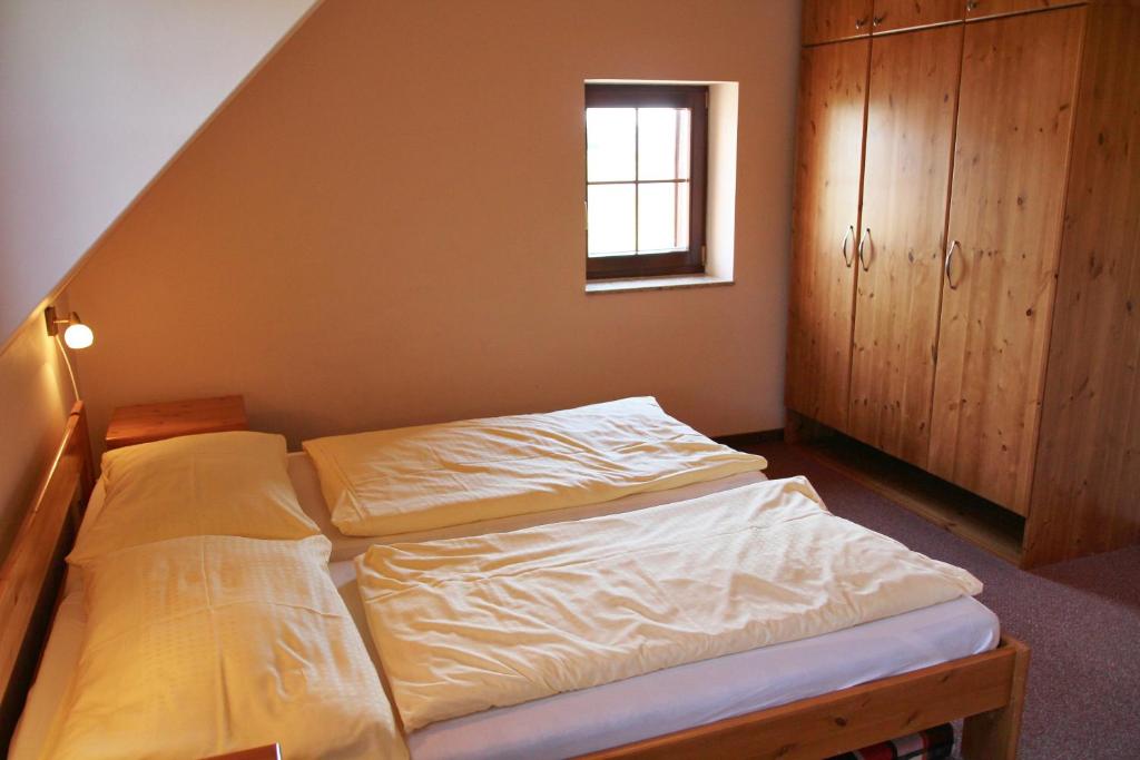 Postel nebo postele na pokoji v ubytování Schneeberg Apartmany