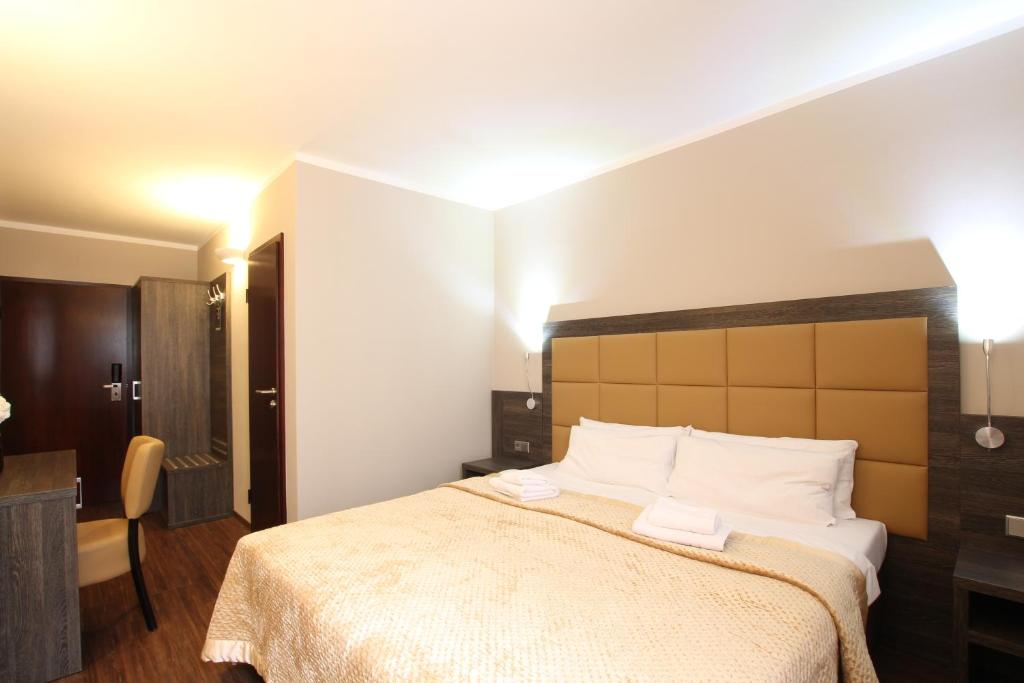 Postel nebo postele na pokoji v ubytování Hotel Delta am Potsdamer Platz