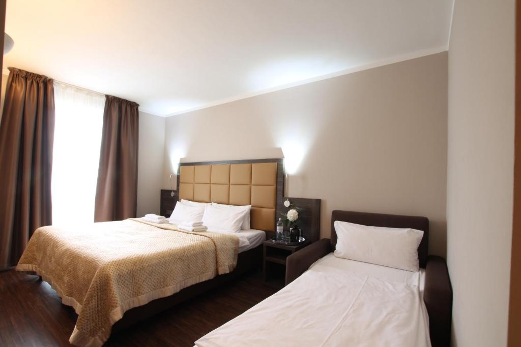 Postel nebo postele na pokoji v ubytování Hotel Delta am Potsdamer Platz