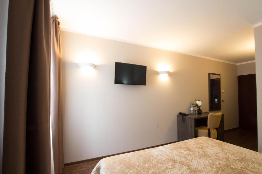 Postel nebo postele na pokoji v ubytování Hotel Delta am Potsdamer Platz
