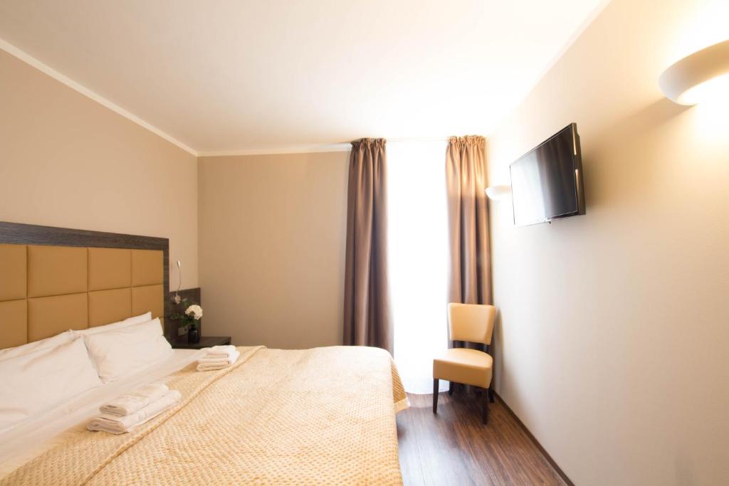 Postel nebo postele na pokoji v ubytování Hotel Delta am Potsdamer Platz