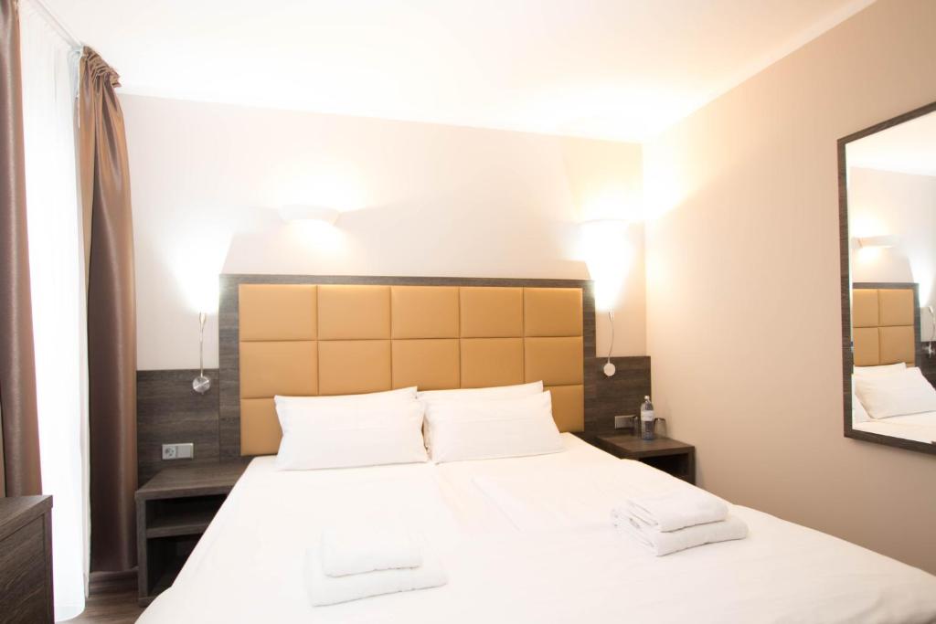 Postel nebo postele na pokoji v ubytování Hotel Delta am Potsdamer Platz