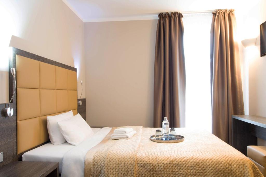 Postel nebo postele na pokoji v ubytování Hotel Delta am Potsdamer Platz