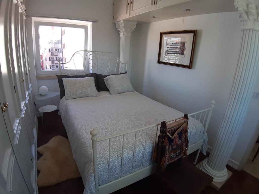 Ένα ή περισσότερα κρεβάτια σε δωμάτιο στο Sunrise Terrace Apartment