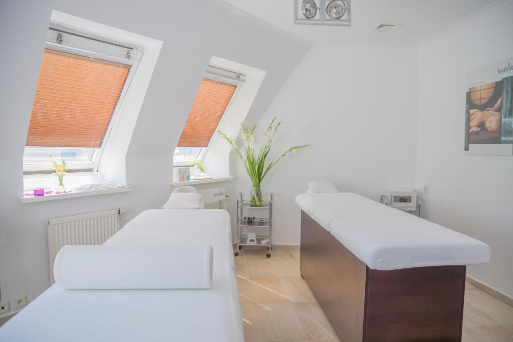 Postel nebo postele na pokoji v ubytování Hotel Rejs