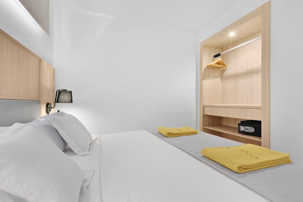 Postel nebo postele na pokoji v ubytování Palmanova Suites by TRH