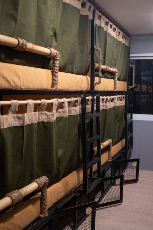 Una cama o camas en una habitación de BAMBAM Hostel
