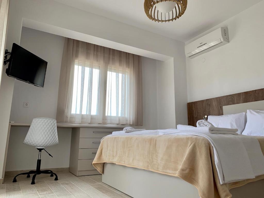 Postel nebo postele na pokoji v ubytování Kalivas beach house