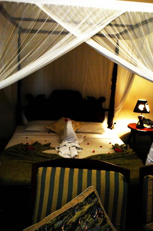 Postel nebo postele na pokoji v ubytování Asmini Palace Hotel