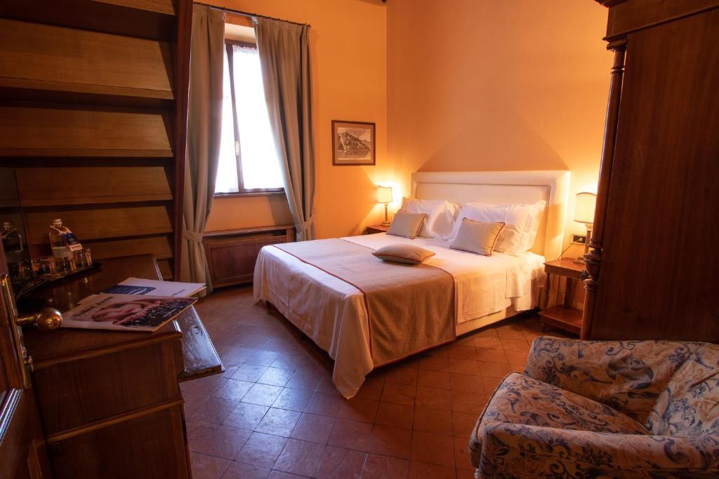 Postel nebo postele na pokoji v ubytování Albergo Le Due Corti