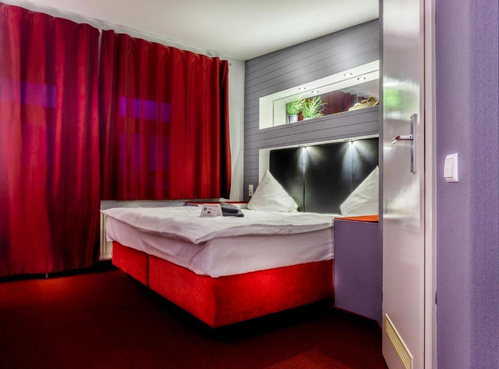 Postel nebo postele na pokoji v ubytování SL'otel - Das StadtHotel - voll Klimatisiert