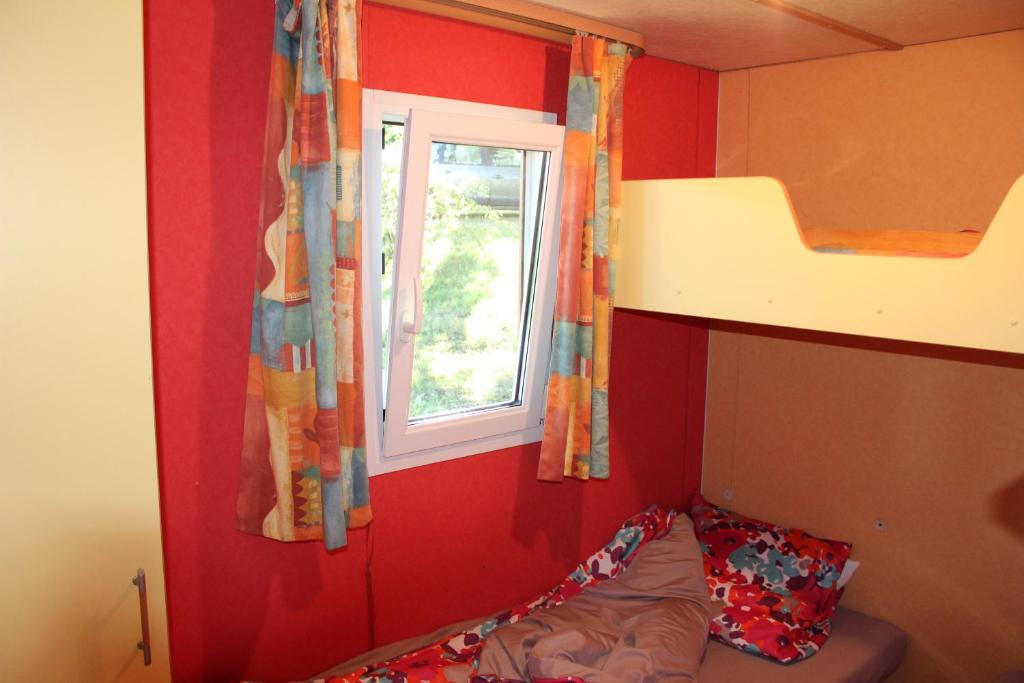 Postel nebo postele na pokoji v ubytování Camping la Chevauchée