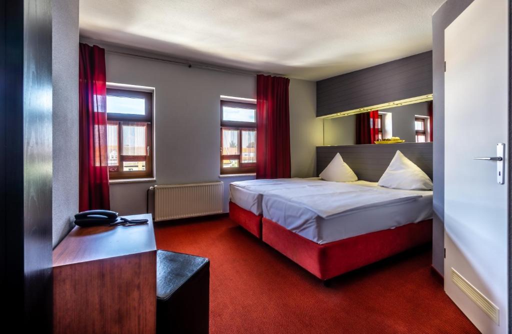 Postel nebo postele na pokoji v ubytování SL'otel - Das StadtHotel - voll Klimatisiert