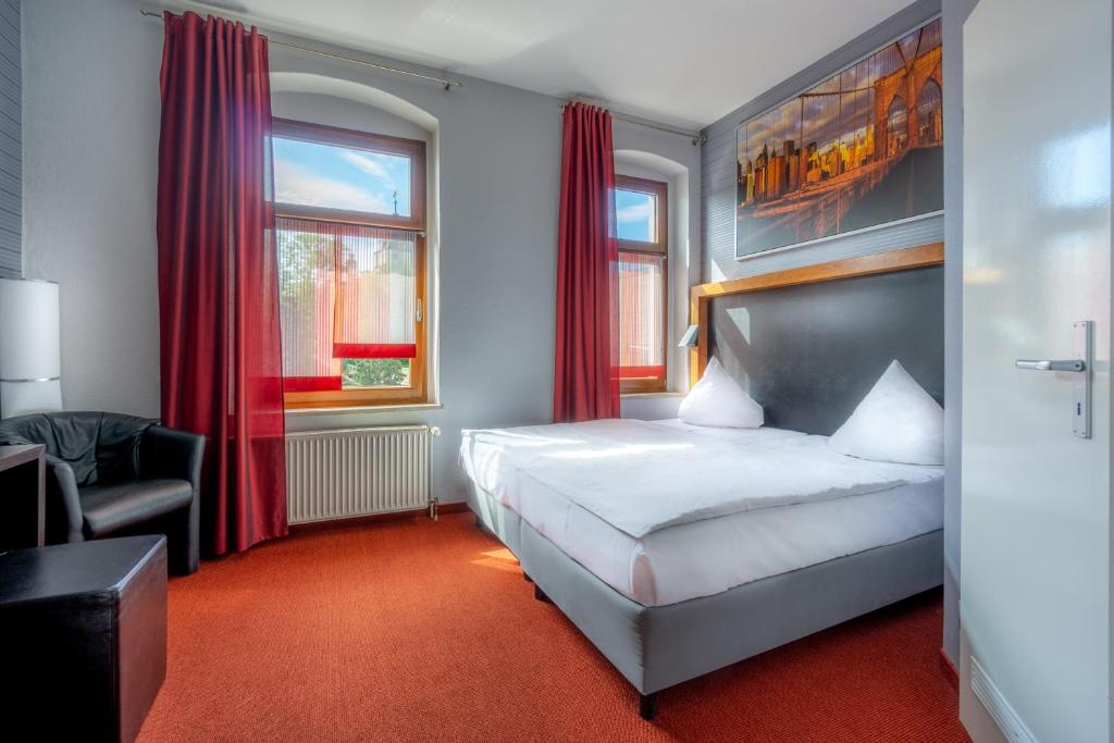 Postel nebo postele na pokoji v ubytování SL'otel - Das StadtHotel - voll Klimatisiert