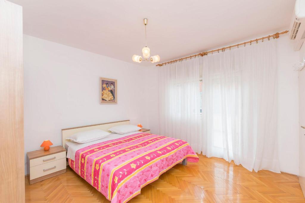 Postel nebo postele na pokoji v ubytování Apartment Sime