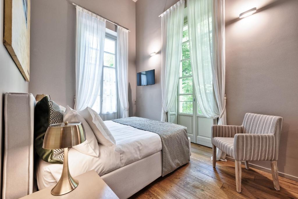 Łóżko lub łóżka w pokoju w obiekcie Palazzo Del Carretto-Art Apartments and Guesthouse
