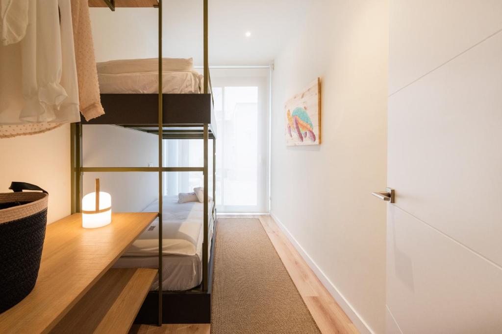 Posteľ alebo postele v izbe v ubytovaní Petit Luxe Tobella Baixos