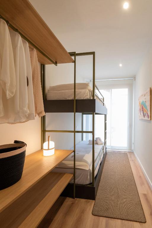 Posteľ alebo postele v izbe v ubytovaní Petit Luxe Tobella Baixos