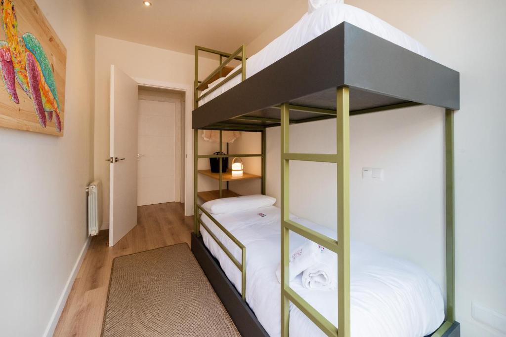 Posteľ alebo postele v izbe v ubytovaní Petit Luxe Tobella Baixos
