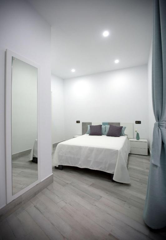 Łóżko lub łóżka w pokoju w obiekcie Apartamento Centro San Diego