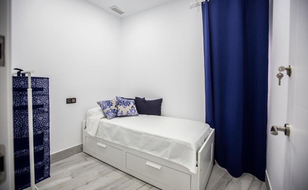 Łóżko lub łóżka w pokoju w obiekcie Apartamento Centro San Diego