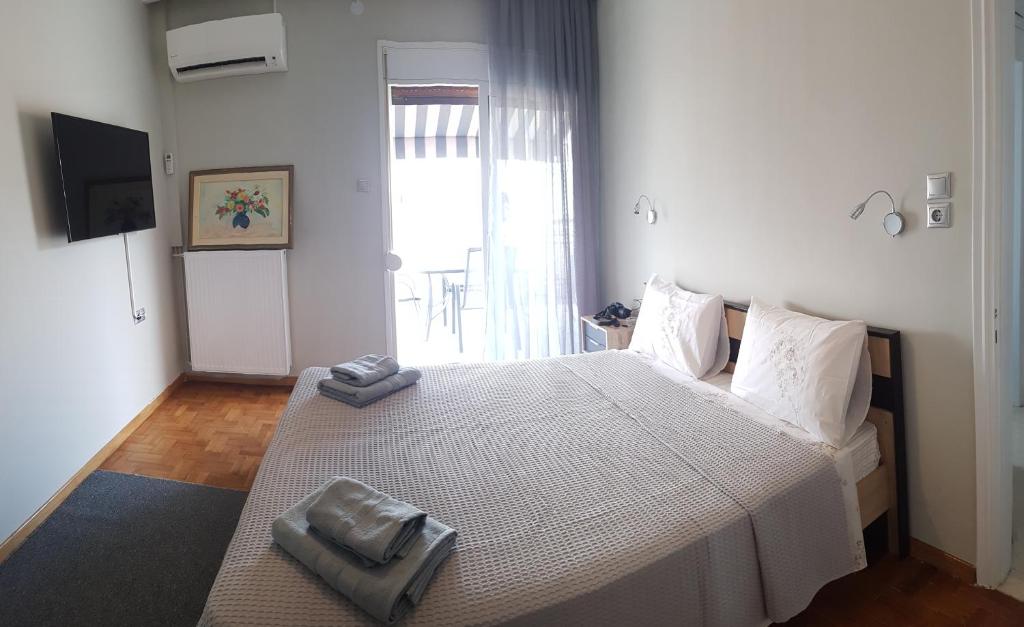 Łóżko lub łóżka w pokoju w obiekcie MAHE APARTMENT