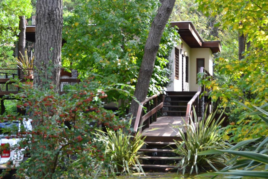 a small house with stairs leading to a garden at La Ventarrón in Mar de las Pampas