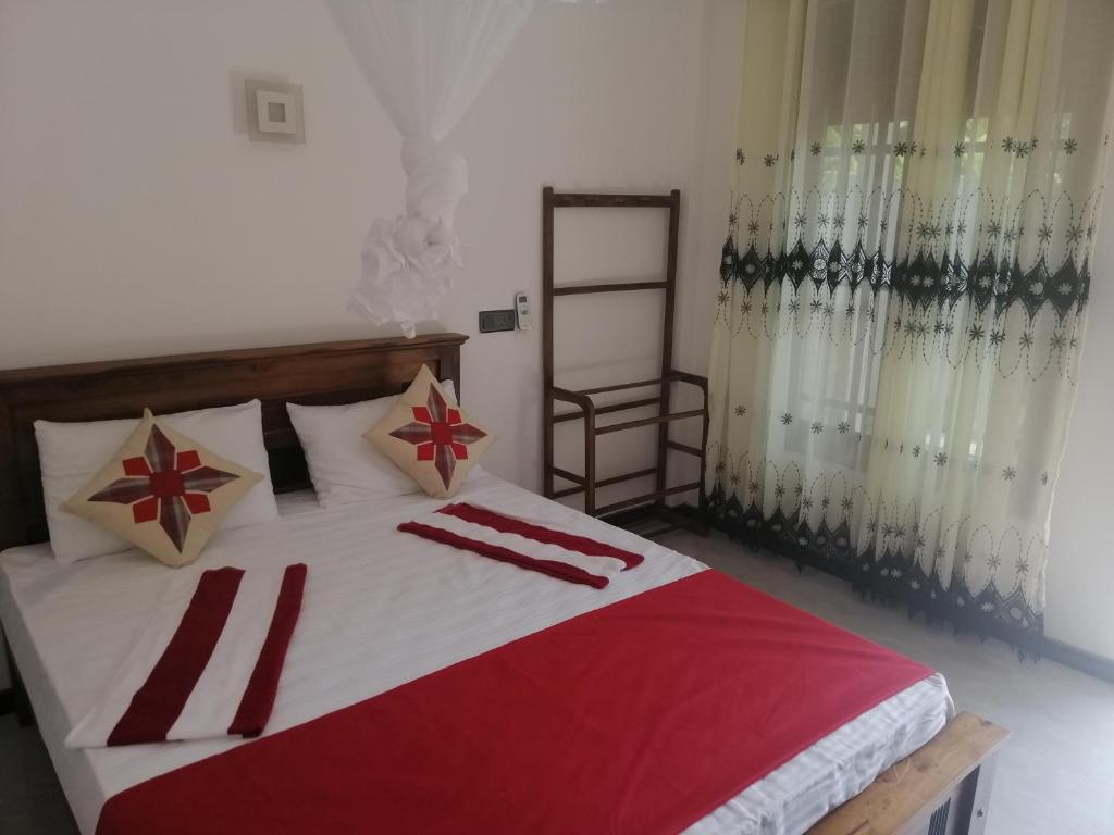 Postel nebo postele na pokoji v ubytování Flip Flop Inn Mirissa