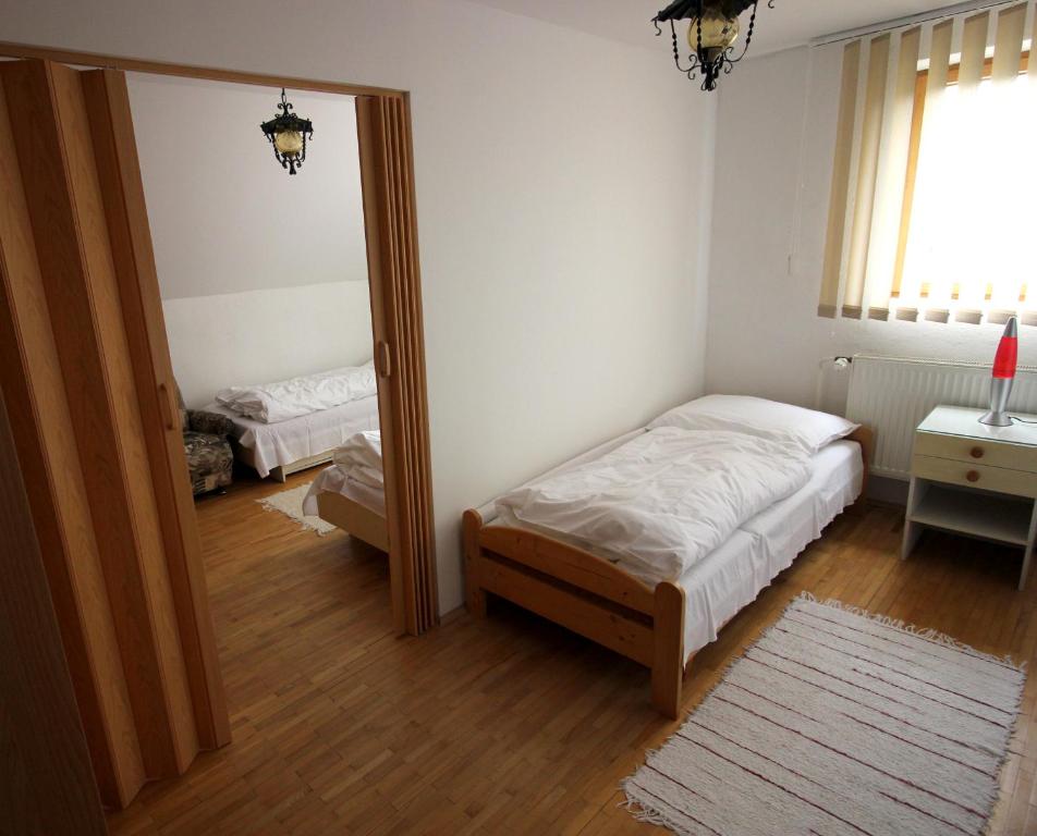 Postel nebo postele na pokoji v ubytování Penzión Alexander