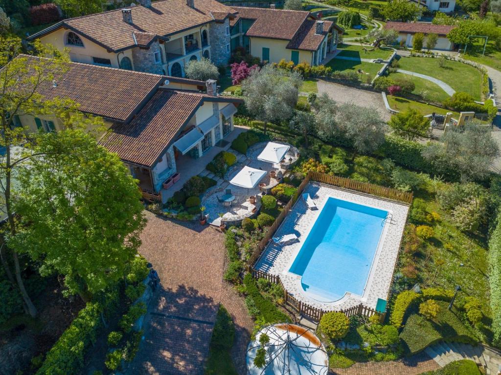an overhead view of a house with a swimming pool at Green Hill Property in Besozzo
