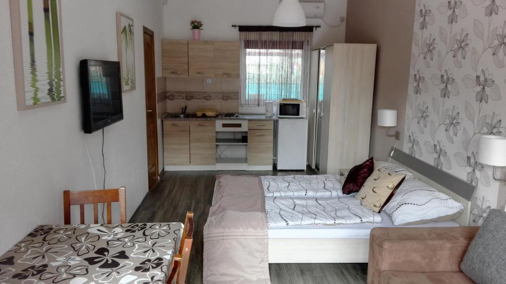 Kuchyňa alebo kuchynka v ubytovaní Sunshine apartman