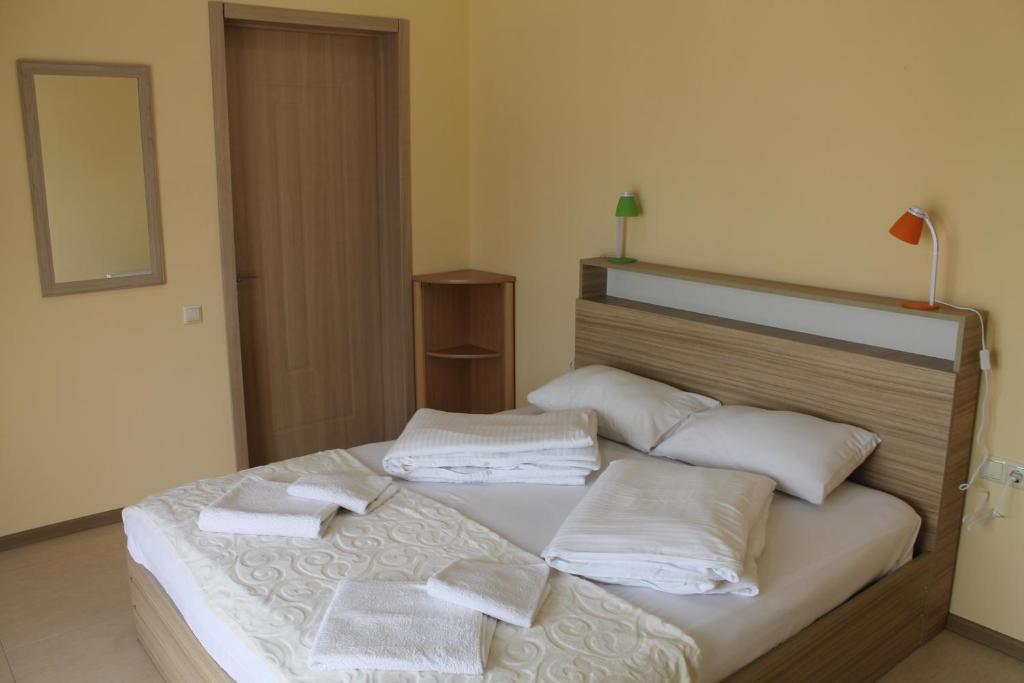 Postel nebo postele na pokoji v ubytování Okro Life