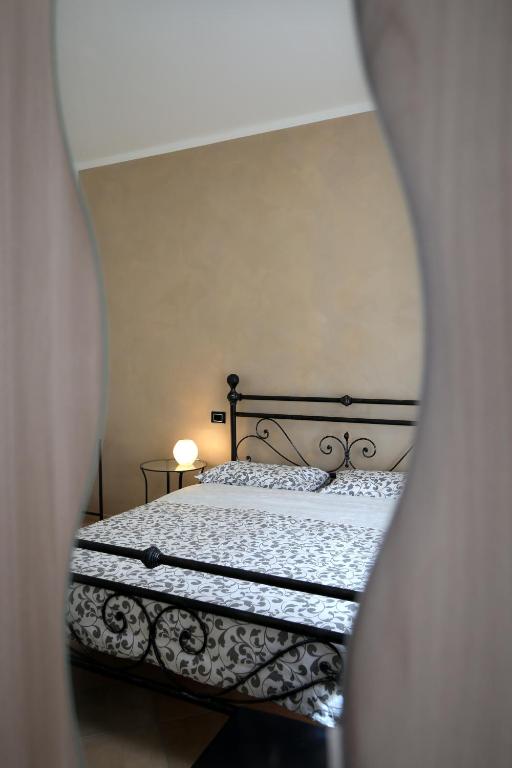 Postel nebo postele na pokoji v ubytování B&B Passalacqua