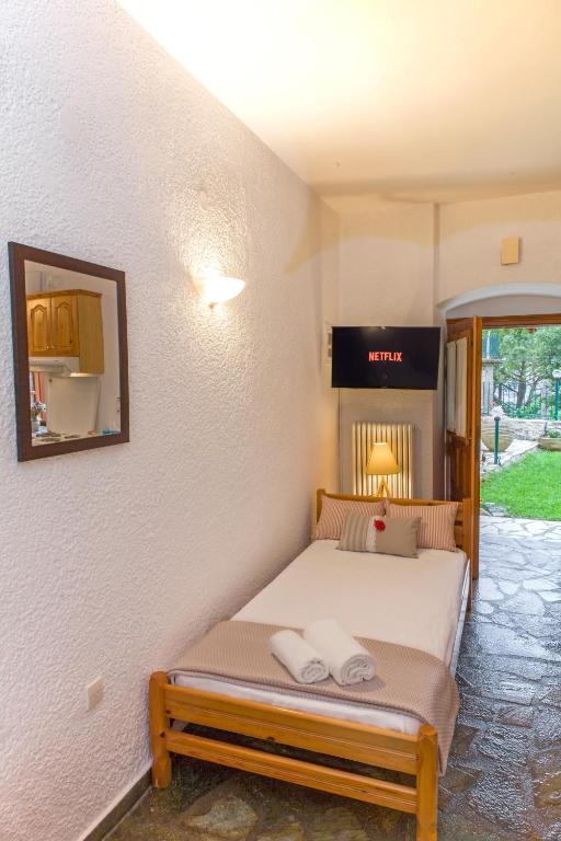 Łóżko lub łóżka w pokoju w obiekcie Villa Kastania