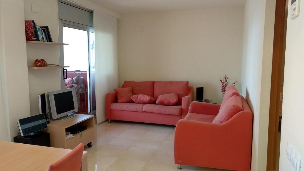 Televízia a/alebo spoločenská miestnosť v ubytovaní MAGNIFICO APARTAMENTO EN CALA LLOBETA