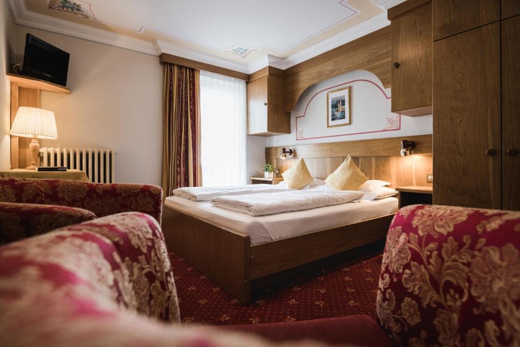 Postel nebo postele na pokoji v ubytování Hotel Monte Cherz
