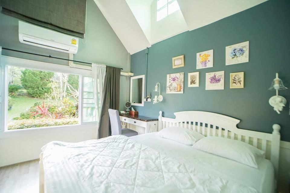 Postel nebo postele na pokoji v ubytování Baan JaoKorKluay บ้านเจ้ากอกล้วย