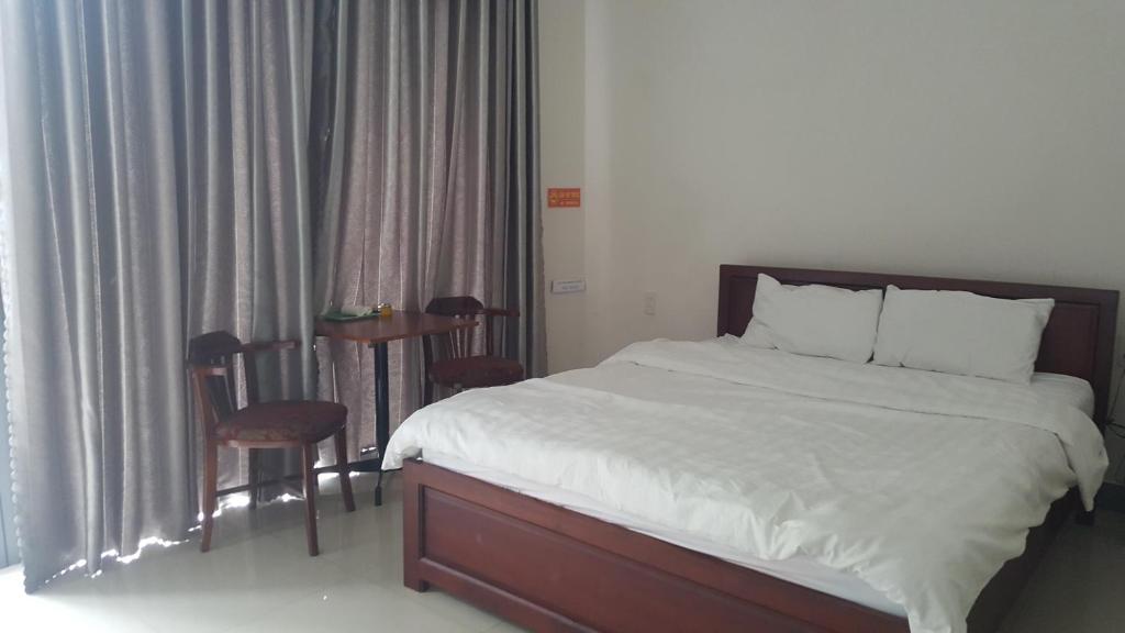 Postel nebo postele na pokoji v ubytování Motel Thanh Long